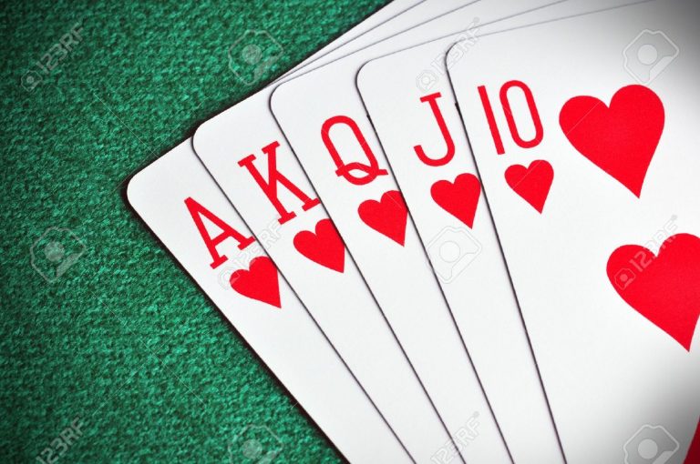 royal-flush-poker-card-sequence-on-a-green-table